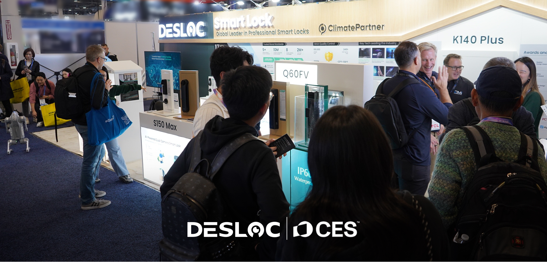 People at a trade show booth with DESLOC and CES branding.